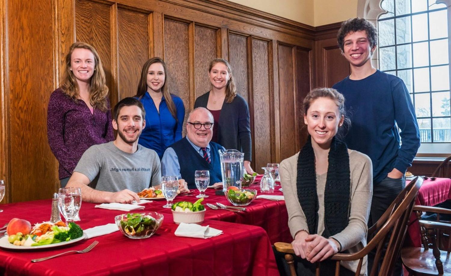 A group of BC undergraduates with Fr. Mark Massa, S.J., at a "Lunches with Jesuits" event