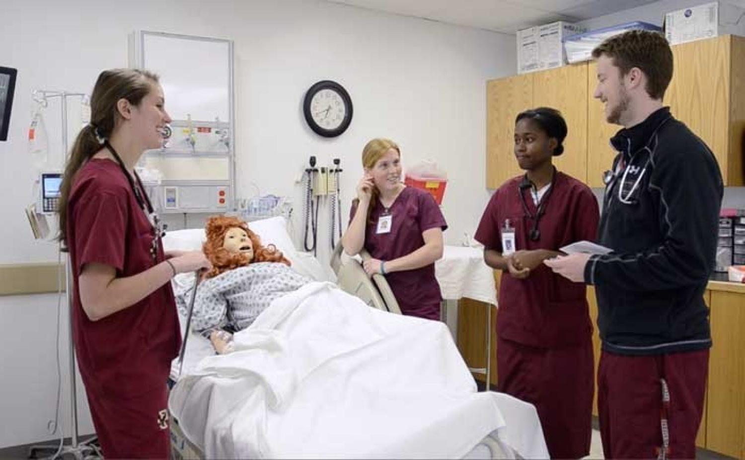 students in scrubs in a hospital setting